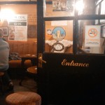 man in pub with sticker for head